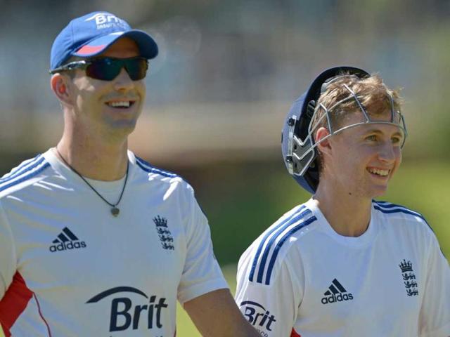 England Ashes Test cricketers Kevin Pietersen and Joe Root walk off the field during a training session at a suburban cricket ground near Perth. (AFP Photo)