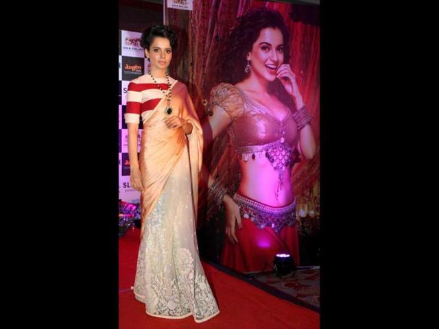 Bollywood actress Kangana Ranaut poses near the poster of her upcoming film Rajjo during the music launch. 