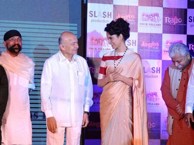 Union Home Minister Sushil Kumar Shinde chats with Kangana Ranaut during the music launch. 