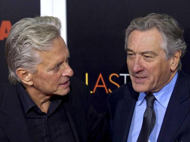 Actors Michael Douglas and Robert De Niro talk while they attend the premiere of the movie Last Vegas in New York. (Reuters Photo)