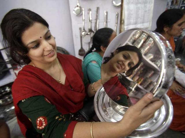 A woman shops for utensils during Dhanteras, which marks the beginning of Hindu festival of lights Diwali, in Jammu. (AP Photo)