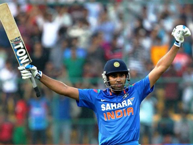 Rohit Sharma celebrates his century during the 7th ODI against Australia at the Chinnaswamy stadium in Bangalore. (PTI Photo)
