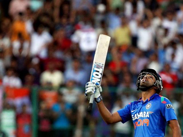 Rohit Sharma celebrates his century during the 7th ODI against Australia at the Chinnaswamy stadium in Bangalore. (PTI Photo)