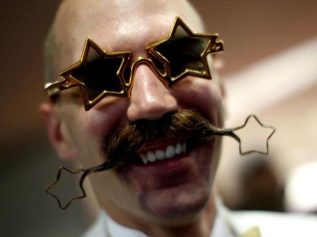 Daniel Lablor of the US poses with his beard art work at the event. (Reuters Photo)