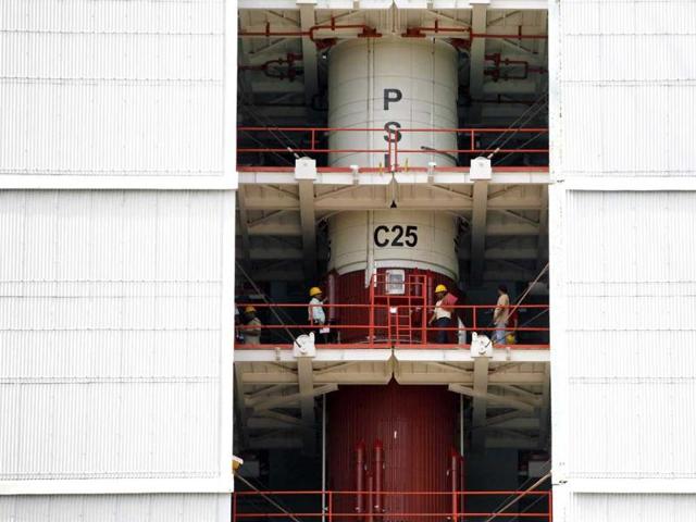Technicians inspect the PSLV-C25 at the Satish Dhawan Space Center in Sriharikota. (AP photo)