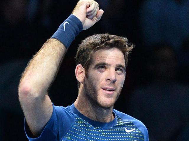 Argentina's Juan Martin Del Potro celebrates beating France's Richard Gasquet during their group B singles match in the round robin stage on the first day of the ATP World Tour Finals tennis tournament in London. (AFP Photo)