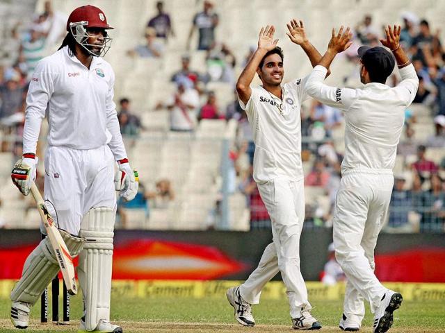 Medium pacer Bhuvneshwar Kumar celebrates after dismissing West Indies opener Chris Gayle at Eden Garden in Kolkata. (PTI photo)