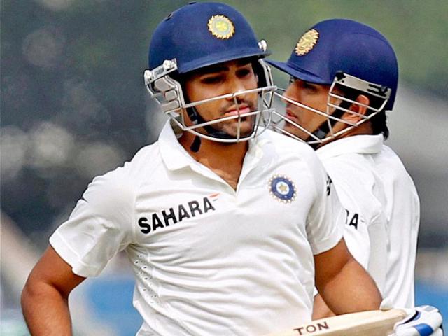 Rohit Sharma with MS Dhoni in action on the 2nd day of the first Test match at Eden Gardens in Kolkata. (PTI Photo)