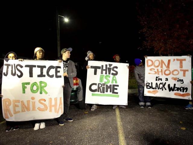 Demonstrators protest against the killing of 19-year-old Renisha McBride outside the Dearborn Heights Police Station in Dearborn Heights, Michigan. (Reuters)