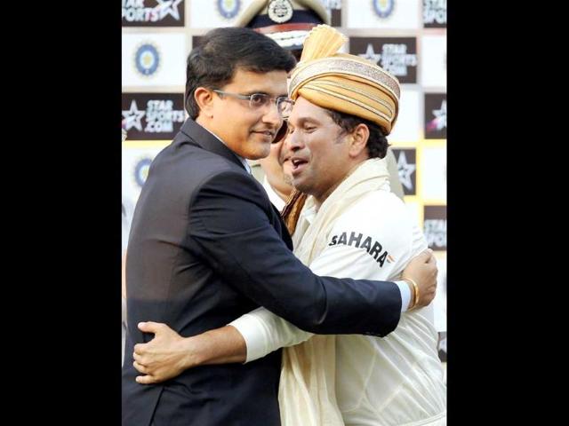 Master blaster Sachin Tendulkar is greeted by former captain Sourav Ganguly at the presentation ceremony after the end of the first Test match against West Indies at Eden Garden in Kolkata. (PTI Photo)