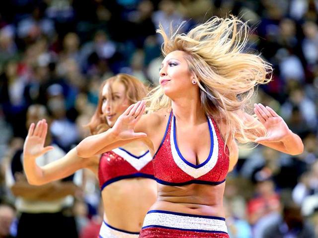 Members of the Wizard Girls preform during the second half of the Washington Wizards and Brooklyn Nets game at Verizon Center in Washington, DC. (AFP photo)