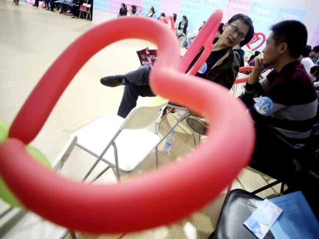 Participants take part in a mass match-making event ahead of Singles Day in Shanghai, China. (AP Photo)
