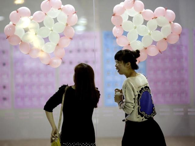 Participants take part in a mass match-making event ahead of Singles Day in Shanghai, China. (AP Photo)