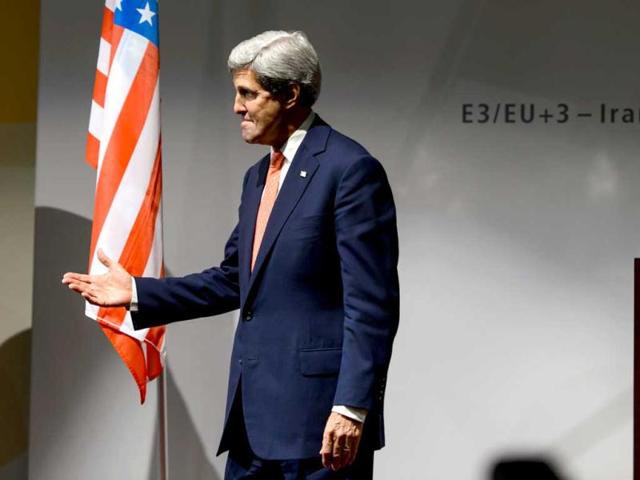 US secretary of state John Kerry leaves the stage after a press conference closing three days of talks on Iran's nuclear programme in Geneva. (AFP Photo)