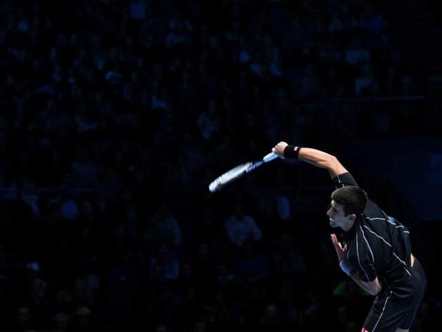 Serbia's Novak Djokovic serves against France's Richard Gasquet during their group B singles match in the round robin stage on the sixth day of the ATP World Tour Finals tennis tournament in London. (AFP Photo)