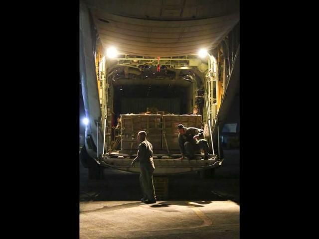 US Marines prepare to unload a pallet of meals ready to eat at Villamor Air Base, in Pasay city, Manila. (Reuters photo)