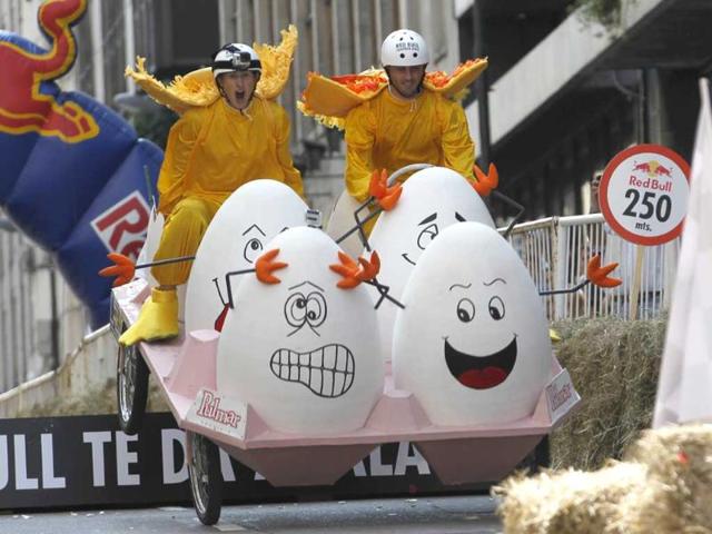 Competitors ride a home-made vehicle without an engine on a 400-metre-track during the Red Bull Soapbox Race in Buenos Aires. (Reuters photo)