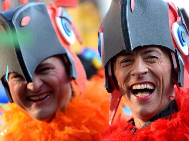Masqueraded revellers celebrate the start of the carnival season in the western German city of Duesseldorf. (AFP Photo)
