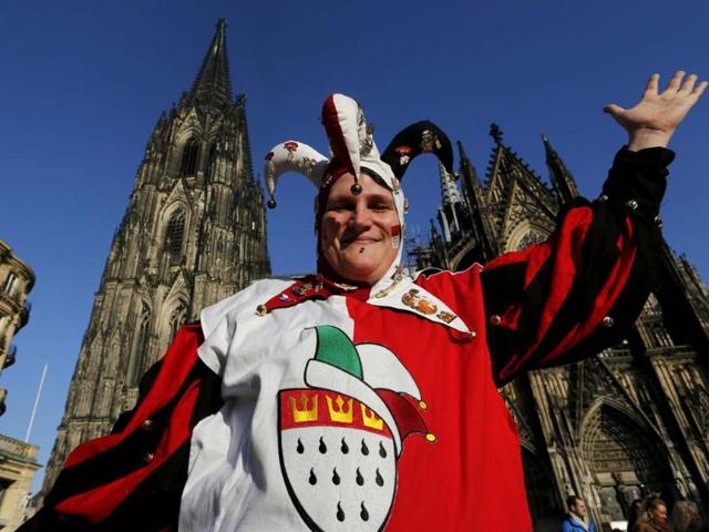 A carnival reveller celebrates the start of the carnival in Cologne. In many parts of Germany, people marked the official start of Carnival. (Reuters Photo)