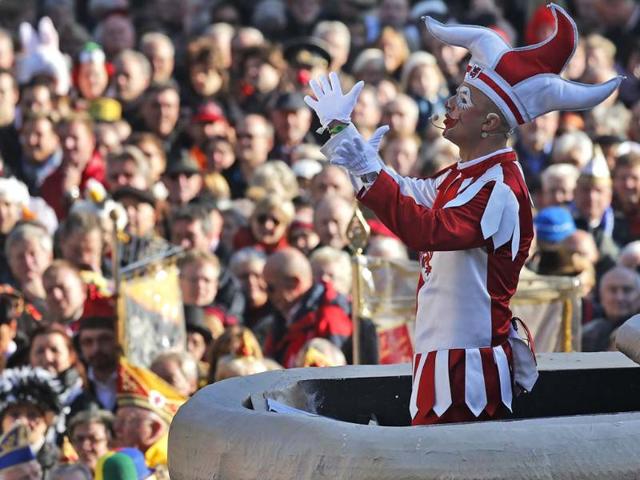 The Hoppeditz, a symbol for carnival, greets hundreds of fools in the streets of downtown Duesseldorf, Germany. (AP Photo)