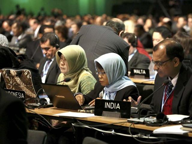 Delegates from Indonesia and India attend the 19th conference of the United Nations Framework Convention on Climate Change (COP19)in Warsaw. (Reuters Photo)