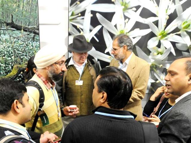 Indian delegates chat at the opening of the conference in Warsaw, Poland, where, thousands of participants from around the world for climate talks. (AP Photo)