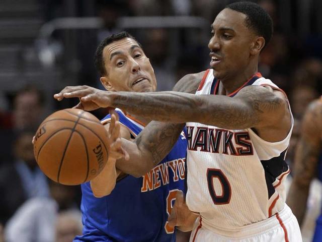 New York Knicks guard Pablo Prigioni (9) knocks the ball away from Atlanta Hawks guard Jeff Teague (0) in the second half of an NBA basketball game in Atlanta. (AP Photo)