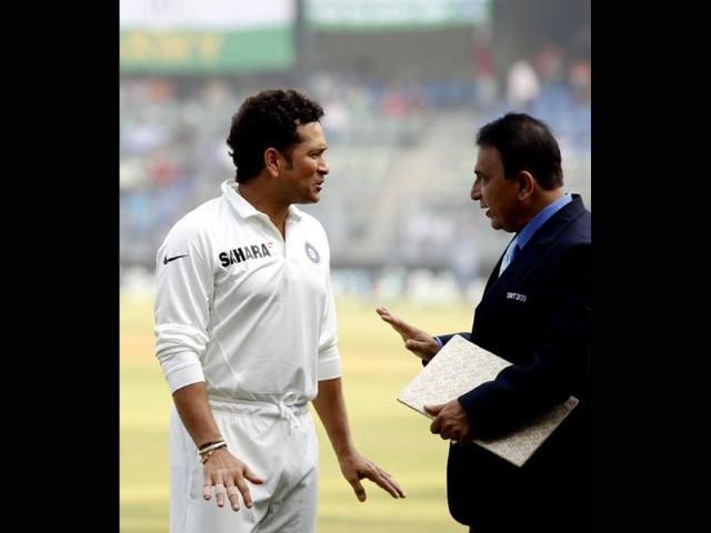 The 'Litte Master' Sunil Gavaskar greets the 'Master Blaster' Sachin Tendulkar during the release of the postal stamp honouring the latter on his final Test match against West Indies at Wankhede Stadium. (Ajay Aggarwal/ HT photo)