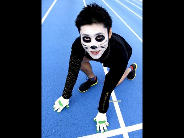 Masao Inuzuka, 36-year-old performer, poses for a photo during a four-legged 100-metre race organized by Kenichi Ito (not in pictured) in Tokyo. Kenichi Ito, 31, who developed his skills over 10 years based on the running style of the African Patas monkey, set a new Guinness World Record on Thursday, clocking in 16:87 seconds for a 100-metre run and breaking his previous record of 17:23 seconds, according to media reports. (Reuters)