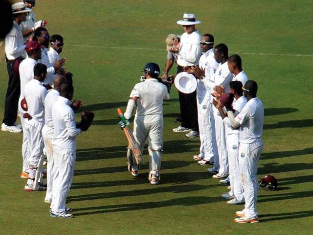 Sachin Tendulkar walks to bat amid a guard of honour on Day 1 of the 2nd Test match against West Indies at Wankhede Stadium in Mumbai. (PTI photo)