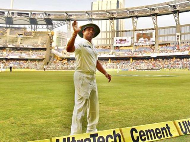 Sachin Tendulkar waves at the crowd during his final Test at Wankhede Stadium. (PTI Photo)