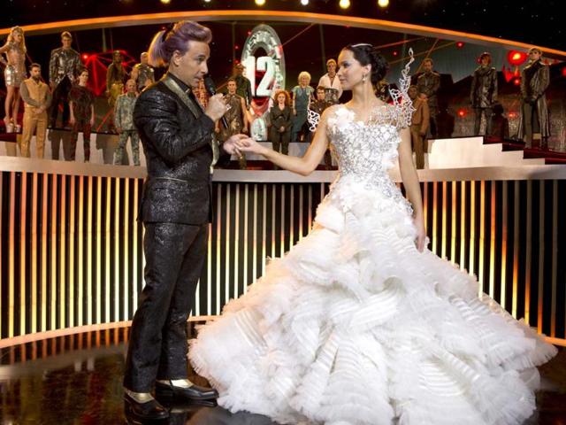 This Lionsgate shows Stanley Tucci as Caesar Flickerman, left, and Jennifer Lawrence as Katniss Everdeen in a scene from "The Hunger Games: Catching Fire." (AP Photo)