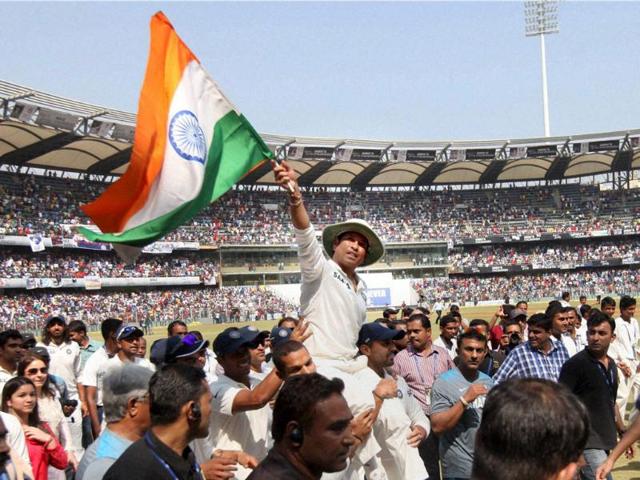 Tendulkar is given a farewell lap by his teammates as they carry him on their shoulders after he bid adieu to International Cricket in Mumbai. (PTI Photo)