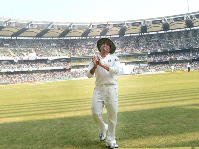 Master Blaster Sachin Tendulkar acknowledges the crowd during the 2nd test match against West Indies at Wankhede stadium in Mumbai. (PTI Photo)