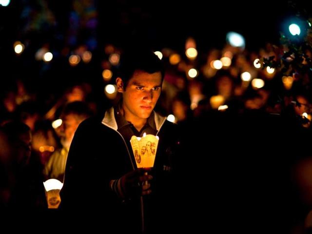 Catholic faithful participate in a procession to commemorate the 24th anniversary of the murder of Father Ignacio Ellacuria in San Salvador. (AFP Photo)
