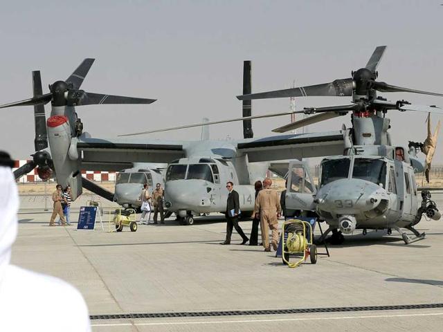 An Emirati citizen looks at US made military hardware displayed at the Dubai Airshow. (AFP Photo)