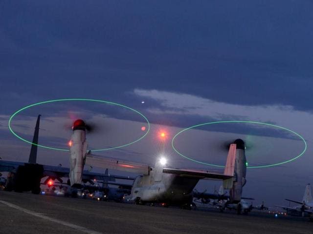 A US Osprey helicopter takes off at Subic military base. The message spelt out in giant letters on the ground outside the remote, typhoon-shattered Philippine village was clear enough: "Help Us. We Need Food". Easily visible as the US helicopter carrying emergency food supplies made its approach Monday, it reflected the desperation of the villagers 10 days after Typhoon Haiyan slammed into the central Philippines. (AFP Photo)