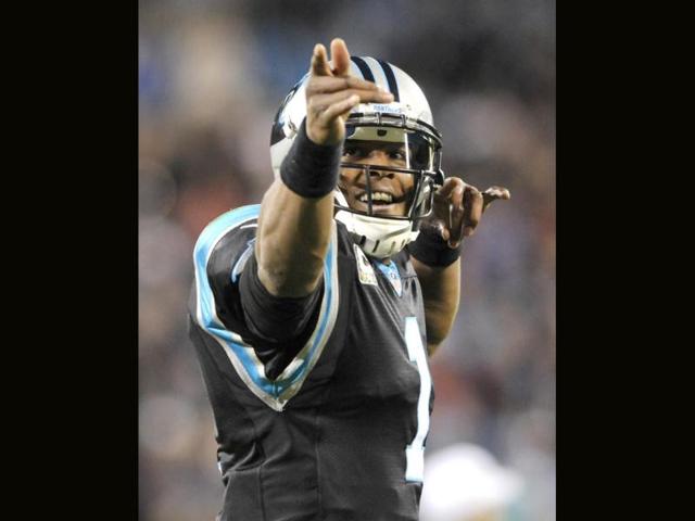 Carolina Panthers' Cam Newton (1) reacts after making a first down against the New England Patriots during the first half of an NFL football game in Charlotte. (AP Photo)