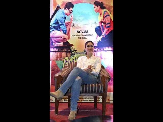 Kareena Kapoor Khan makes herself comfortable in a chair.