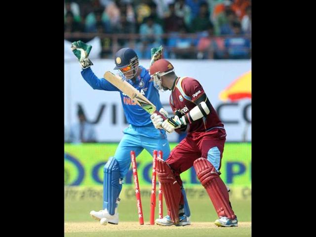 Marlon Samuels of West Indies is bowled during the 1st ODI match against India in Kochi. (PTI photo)