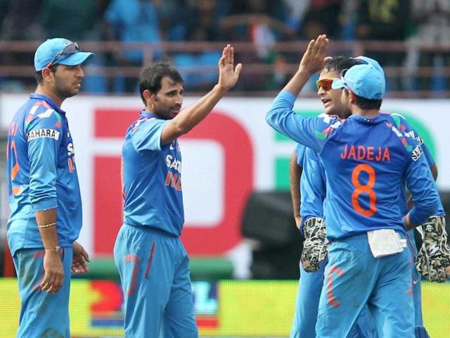 Shammi Ahmed with team mates celebrates the wicket of Darren Bravo of West Indies during the 1st ODI match at Jawaharlal Nehru Stadium in Kochi. (PTI photo)