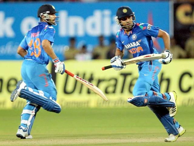 Rohit Sharma and Virat Kohli take runs against West Indies during the 1st ODI in Kochi. (PTI photo)