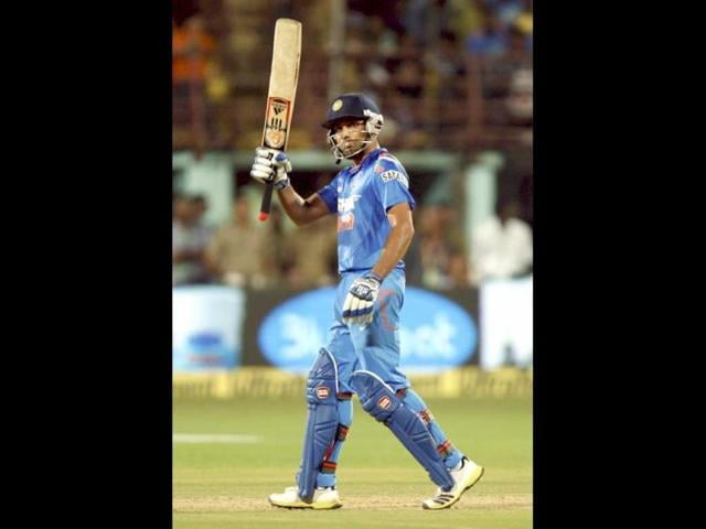 Rohit Sharma celebrate his fifty runs against West Indies during the 1st ODI in Kochi. (PTI photo)