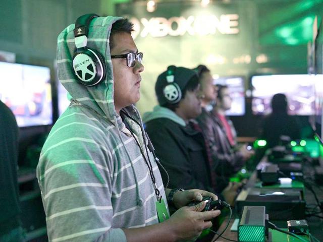 Video game fans line up to try out the new Xbox game at its official launch celebrations in the US. (AP Photo)