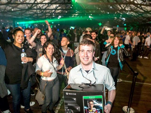 Daniel Livingstone became the first official owner in the world of the Xbox One console during an official midnight launch party in Auckland. (AFP Photo)
