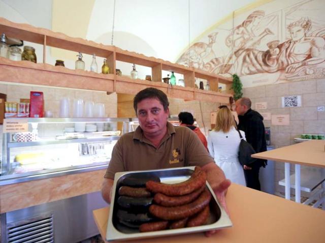 Downtown butcher Tamas Balla shows off his sausages in Budapest. Budapest offers a wealth of choices for lovers of music, art and architecture in a beautiful setting on the Danube river. (Reuters Photo)
