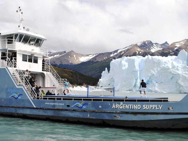 Novak Djokovic (R) of Serbia and Rafael Nadal of Spain play an exhibition tennis match at a court set up on the deck of the "Argentino Supply" cargo ship, as the Perito Moreno glacier is seen in the background, near the Patagonian city of El Calafate. (Reuters)