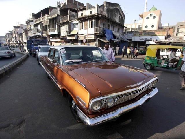A man drives his vintage Chevrolet during a vintage car rally in Ahmadabad. The rally was held as part of the World Heritage Week celebrations. (AP Photo)