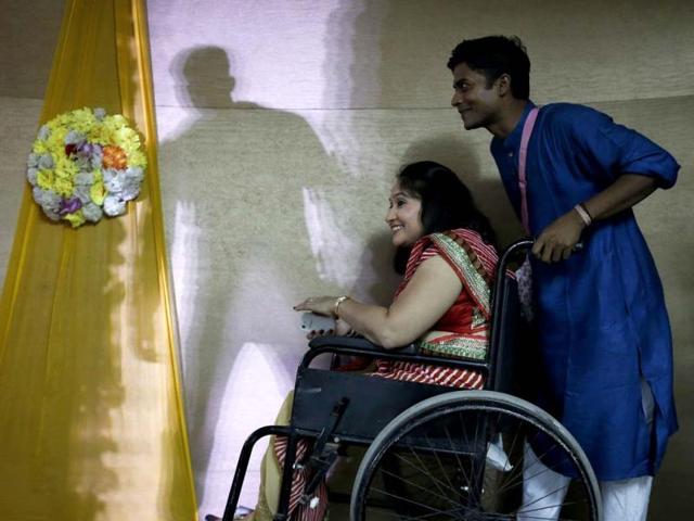 A competitor watches a performance from backstage during Miss Wheelchair India, the country's first wheelchair beauty pageant. (Reuters Photo)