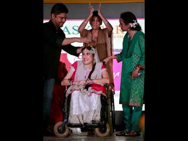 Nirmala, center, is crowned Miss Wheelchair India beauty at the final of the contest. (AP Photo)